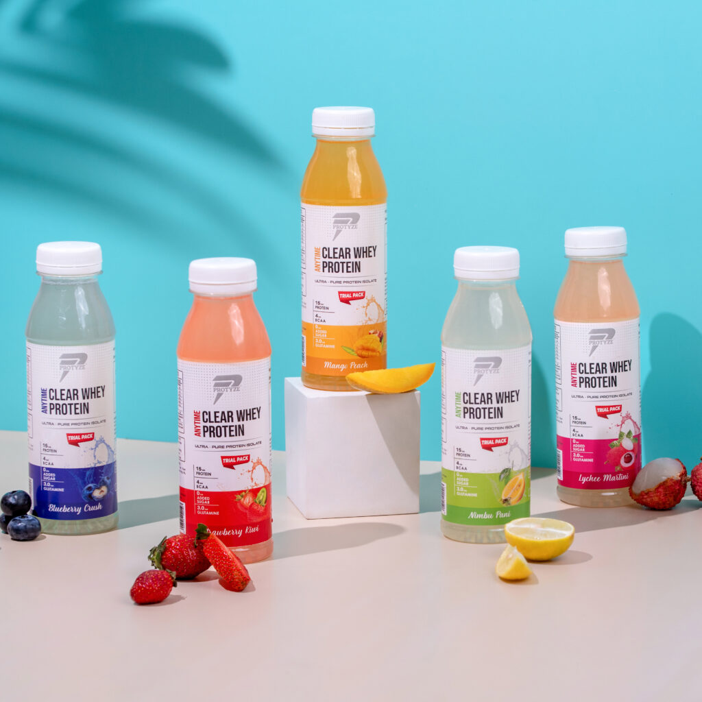 styled with summer vibe for the protein drink arranged with the specific fruits in each flavor