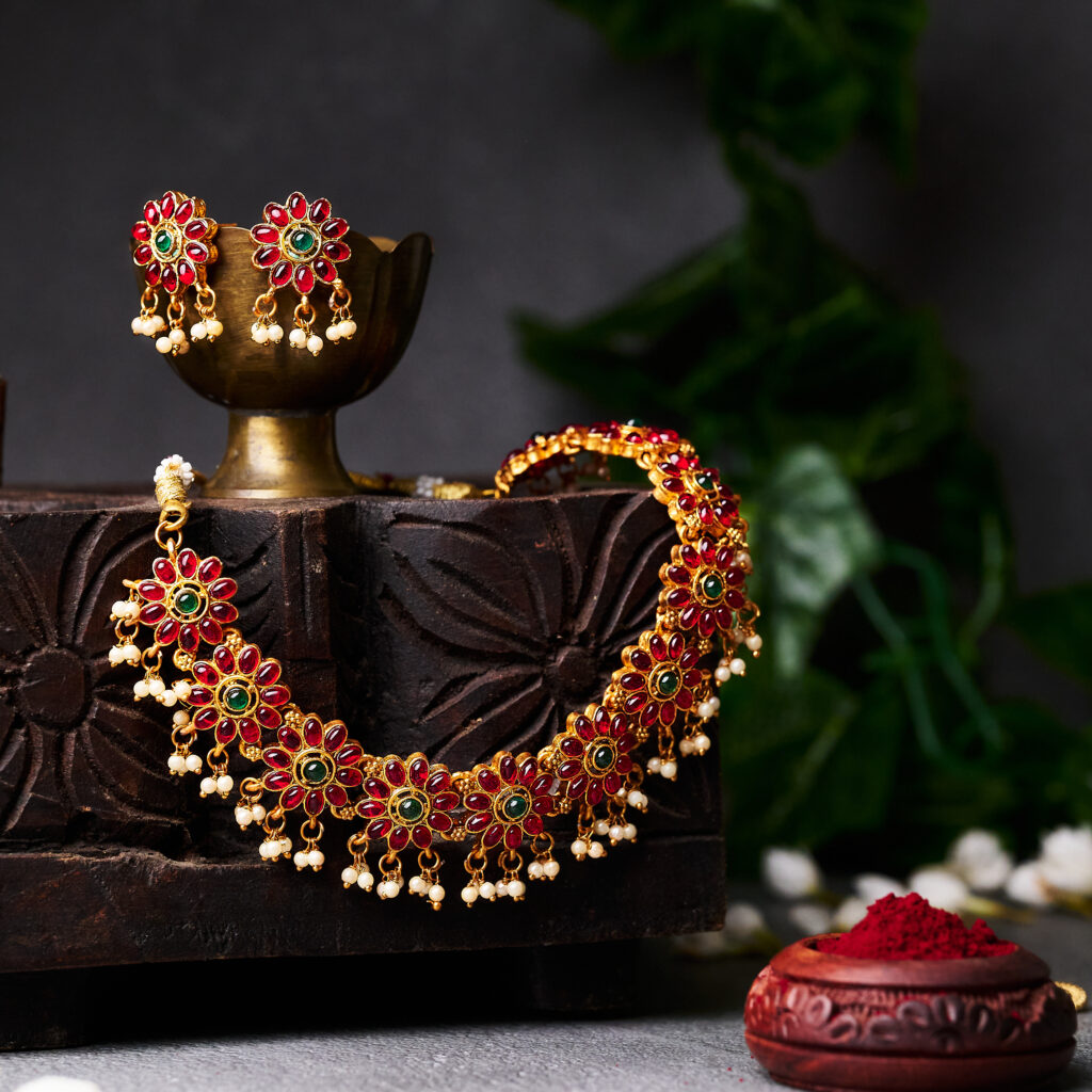 chain and ear ring set photo arranged in a rustic box with a vintage background