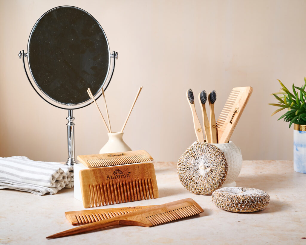 brush, comb, scrub in bathroom setup for aurorah products